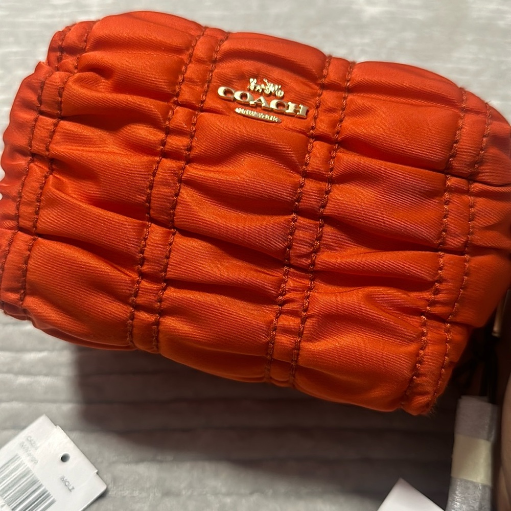Orange coach cosmetics bag